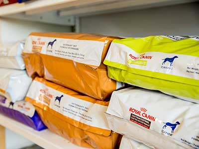 bags of dog food on a shelf